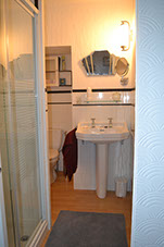 Private en-suite bathroom with shower, toilet and sink. Towels and shower products are provided free of charge.